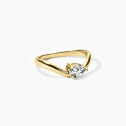 Pear-cut moissanite chevron ring in yellow gold vermeil, angled view.