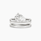 Pear-cut moissanite double-band solitaire ring in white gold vermeil, front view.