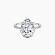 Pear-cut moissanite halo ring with pavé band in white gold vermeil, front view.