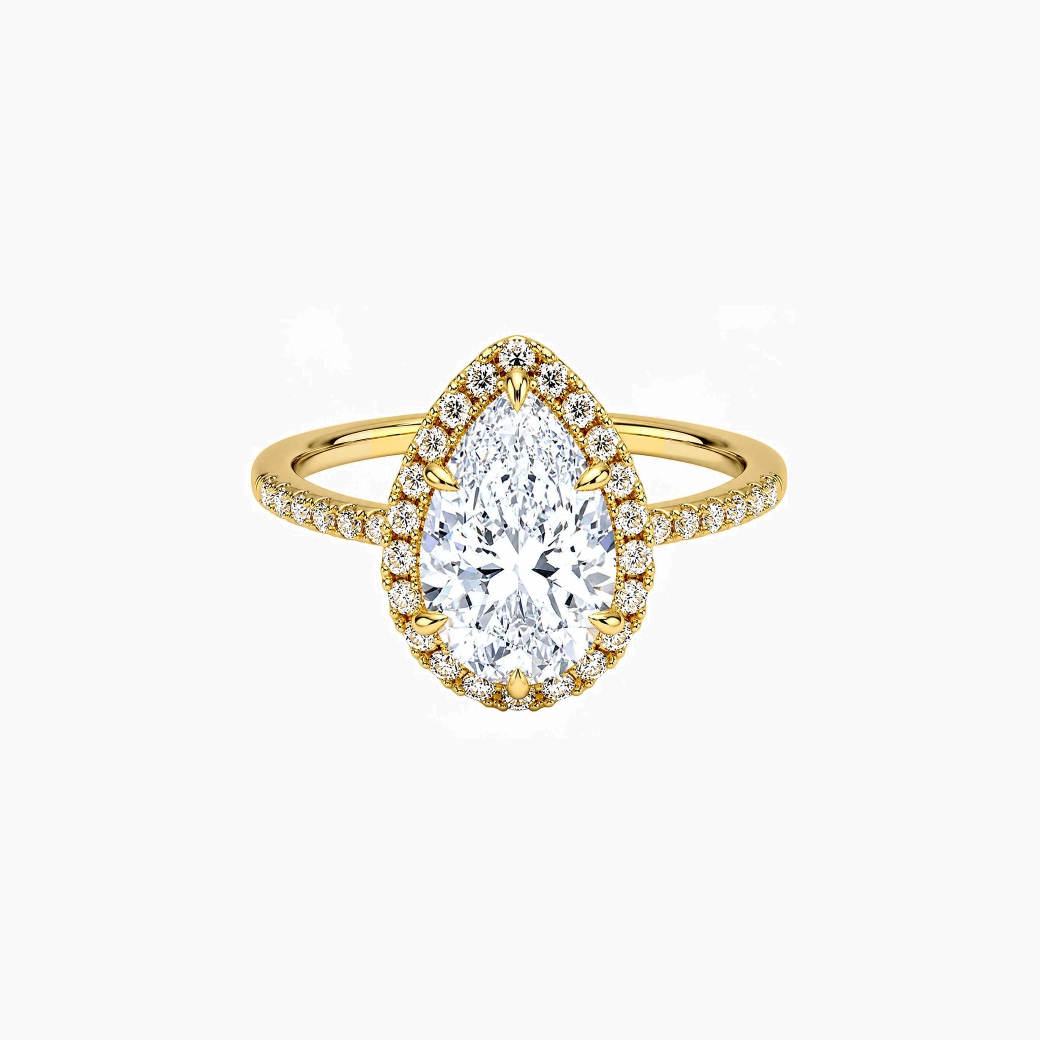 Pear-cut moissanite halo ring with pavé band in yellow gold vermeil, front view.