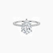 Pear-cut moissanite hidden halo ring with pavé band in white gold vermeil, front view.