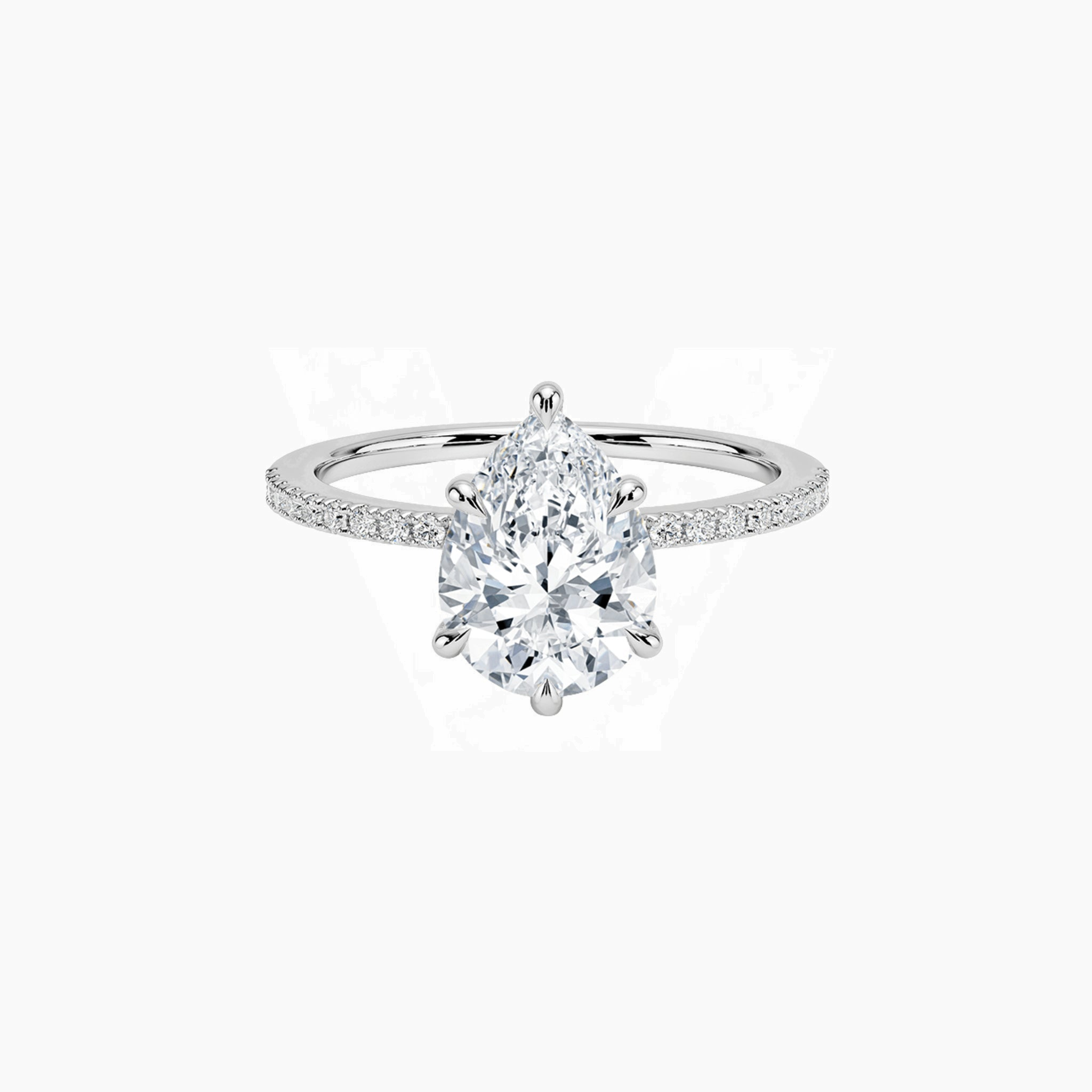 Pear-cut moissanite hidden halo ring with pavé band in white gold vermeil, front view.