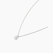 Pear-cut moissanite pendant necklace in white gold vermeil, side view.
