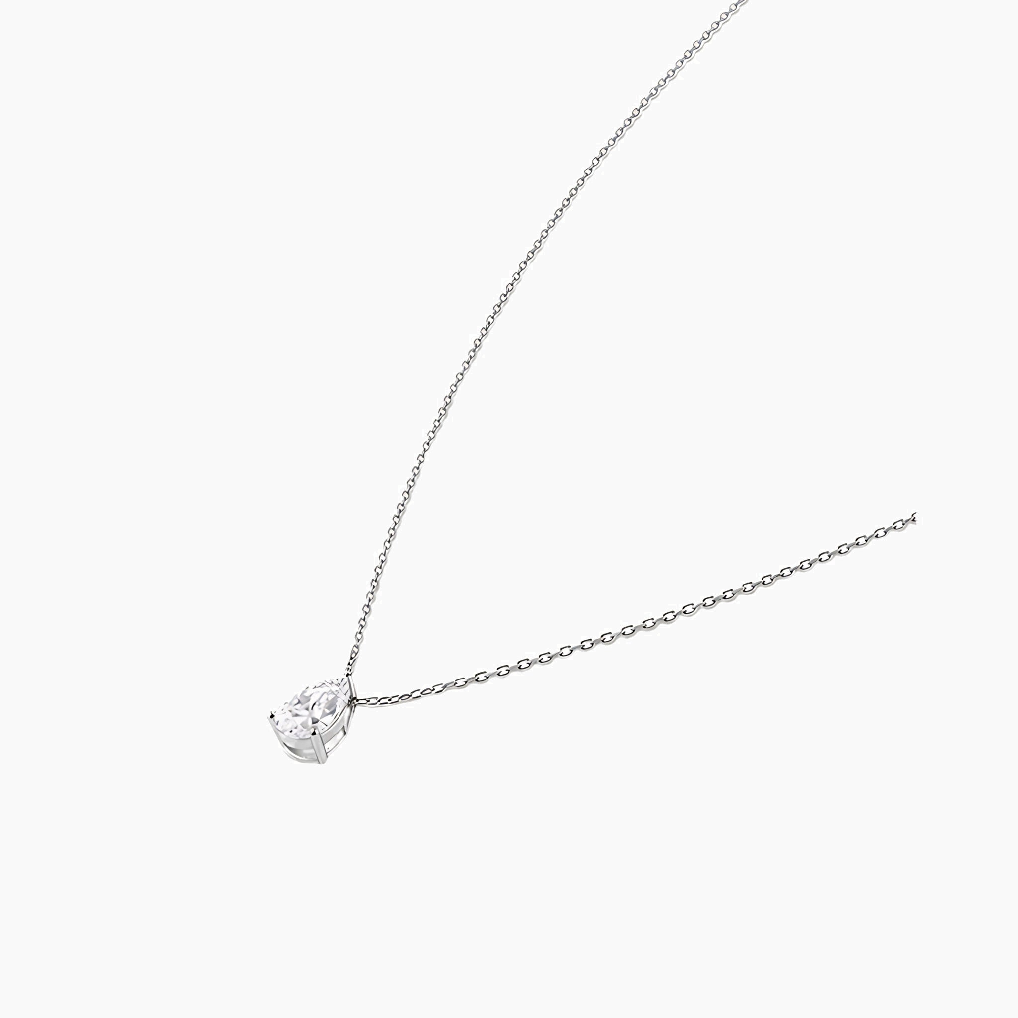 Pear-cut moissanite pendant necklace in white gold vermeil, side view.