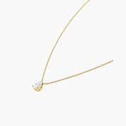 Pear-cut moissanite pendant necklace in yellow gold vermeil, side view.