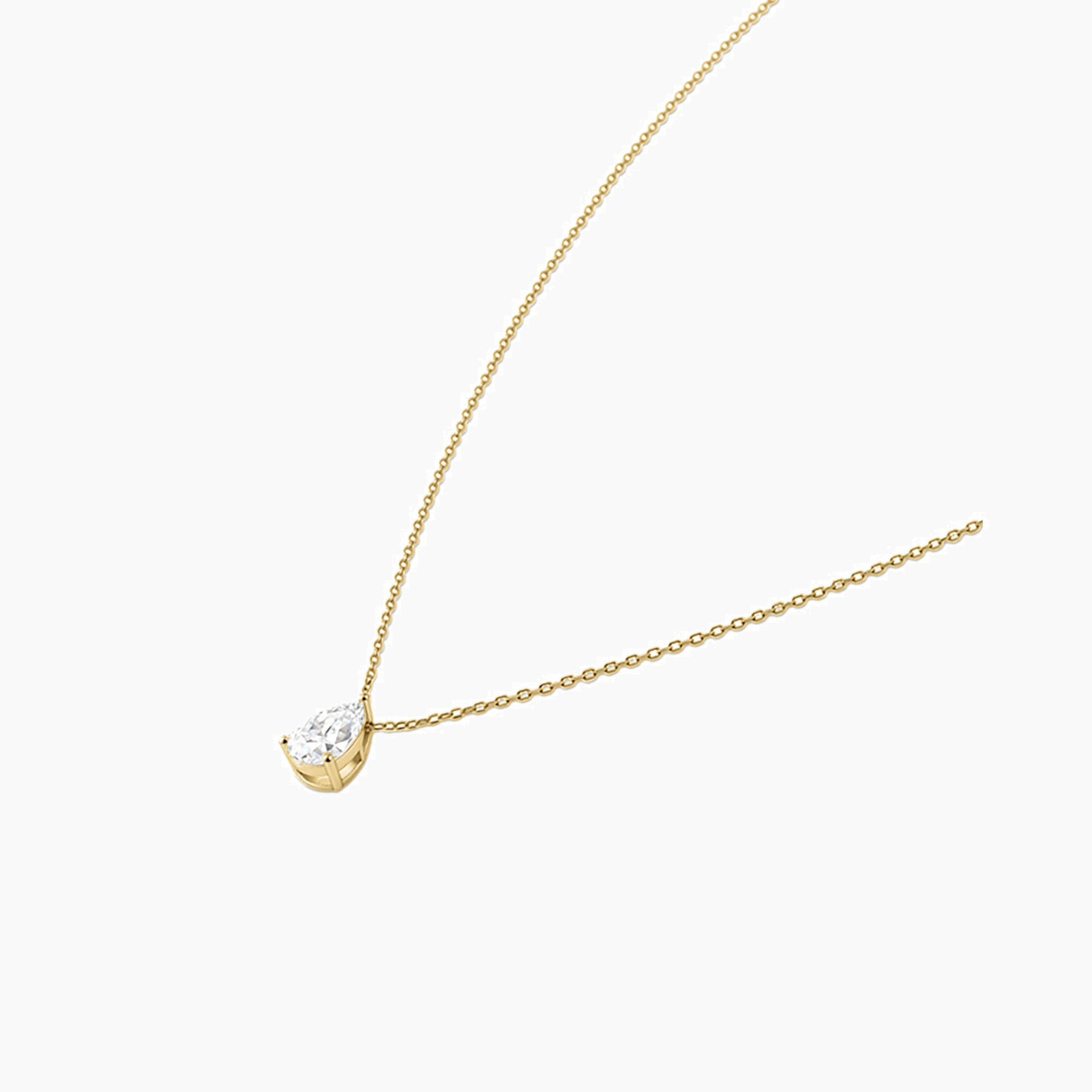 Pear-cut moissanite pendant necklace in yellow gold vermeil, side view.