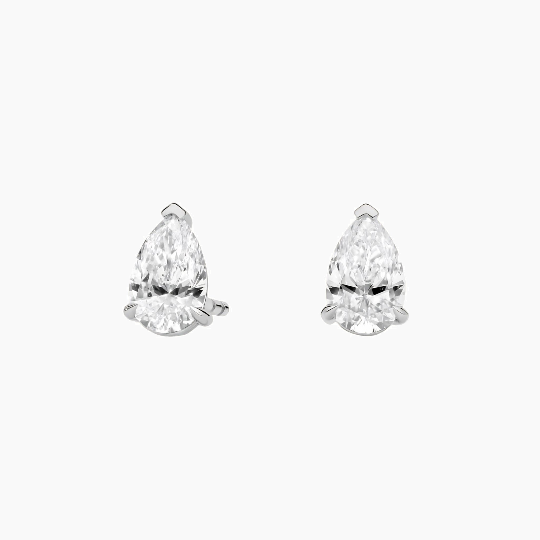 Pear-cut moissanite stud earrings in white gold vermeil, front view.