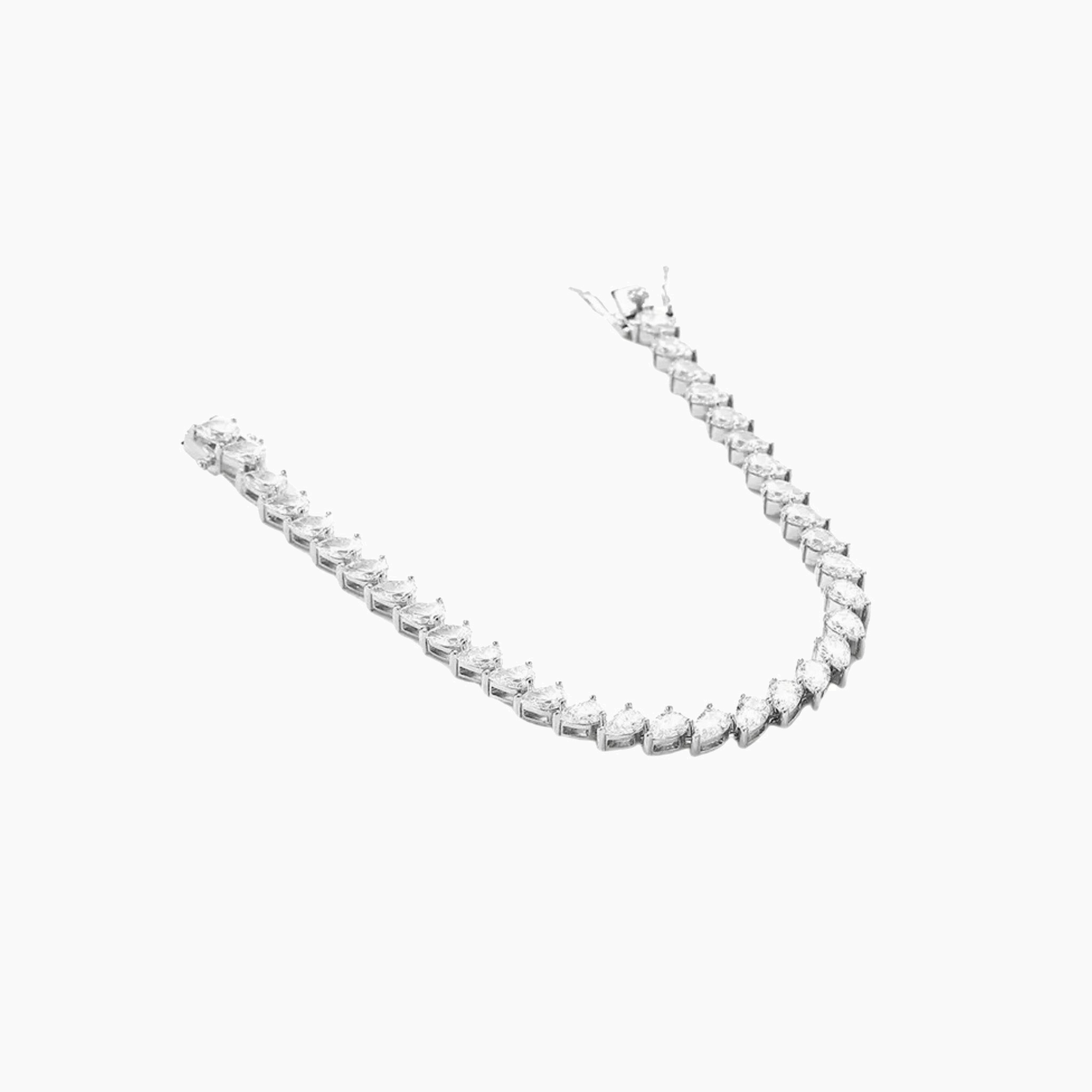 Pear-cut moissanite tennis bracelet in white gold vermeil, open view showing the closure.