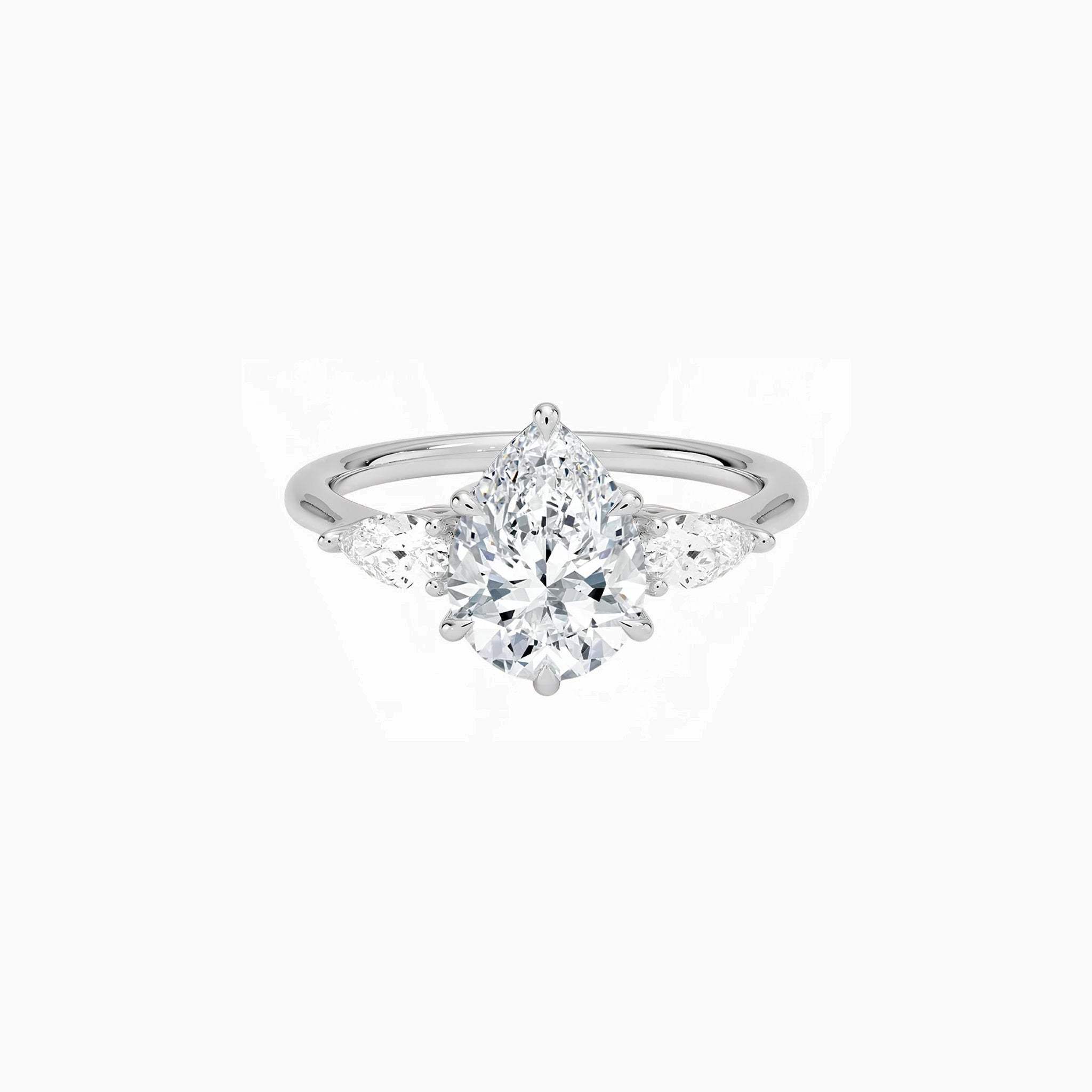 Pear-cut moissanite three-stone ring in white gold vermeil, front view.