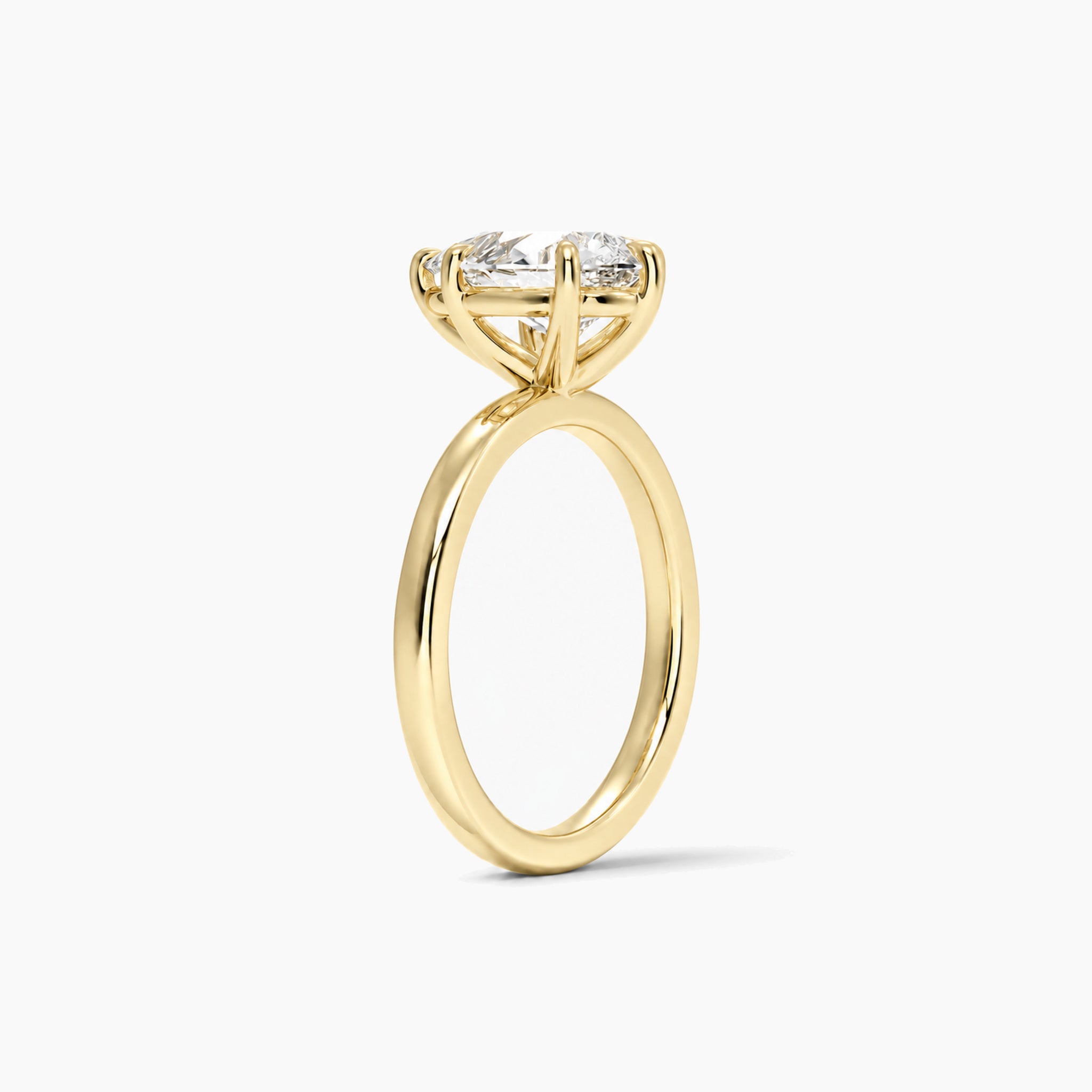 Pear-Cut Moissanite Solitaire Ring in yellow gold vermeil, side view