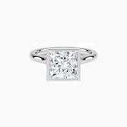 Princess-cut moissanite bezel solitaire ring in white gold vermeil, front view.
