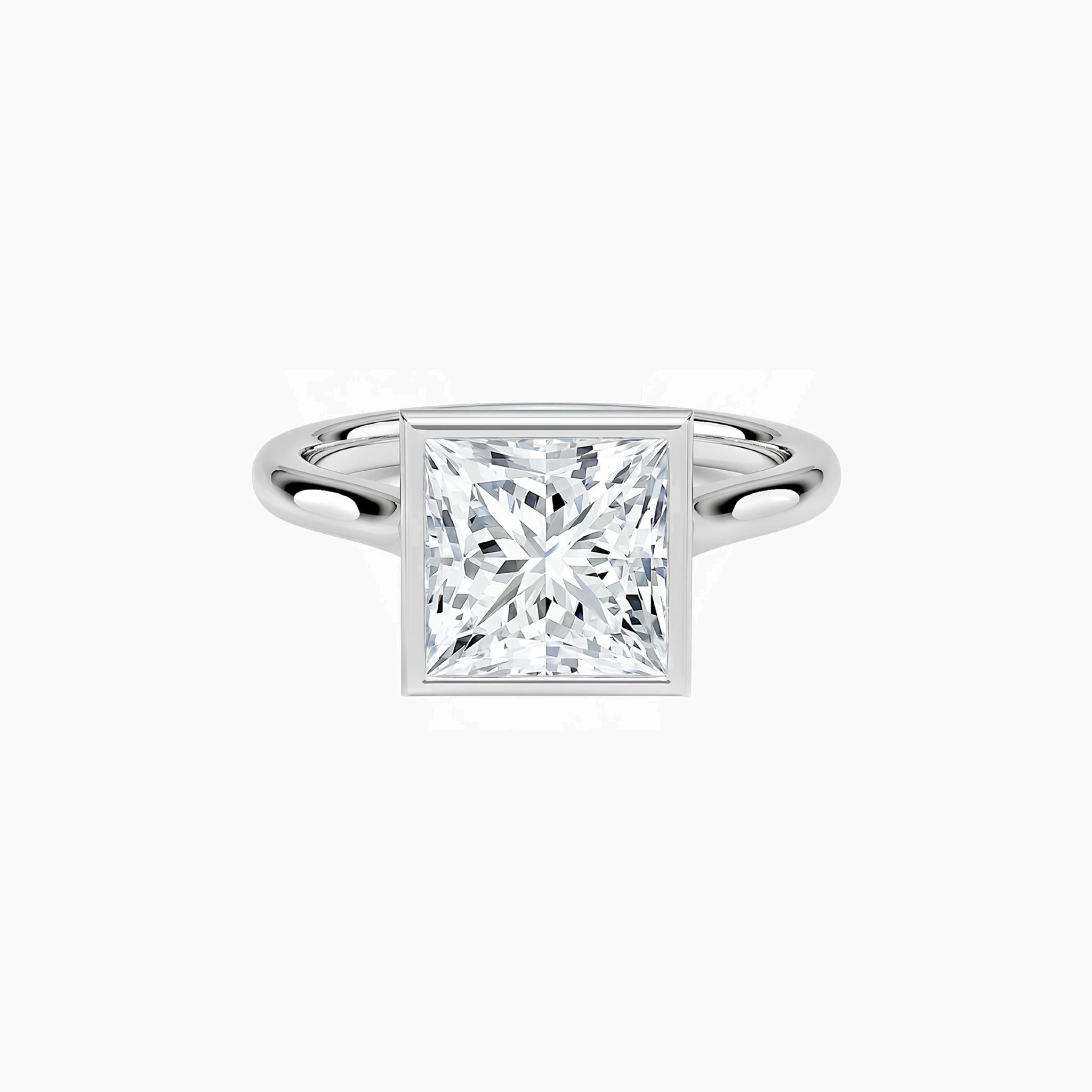 Princess-cut moissanite bezel solitaire ring in white gold vermeil, front view.