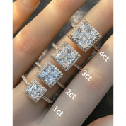 Princess-cut moissanite halo ring with pavé band rings arranged across fingers for a carat-size comparison.