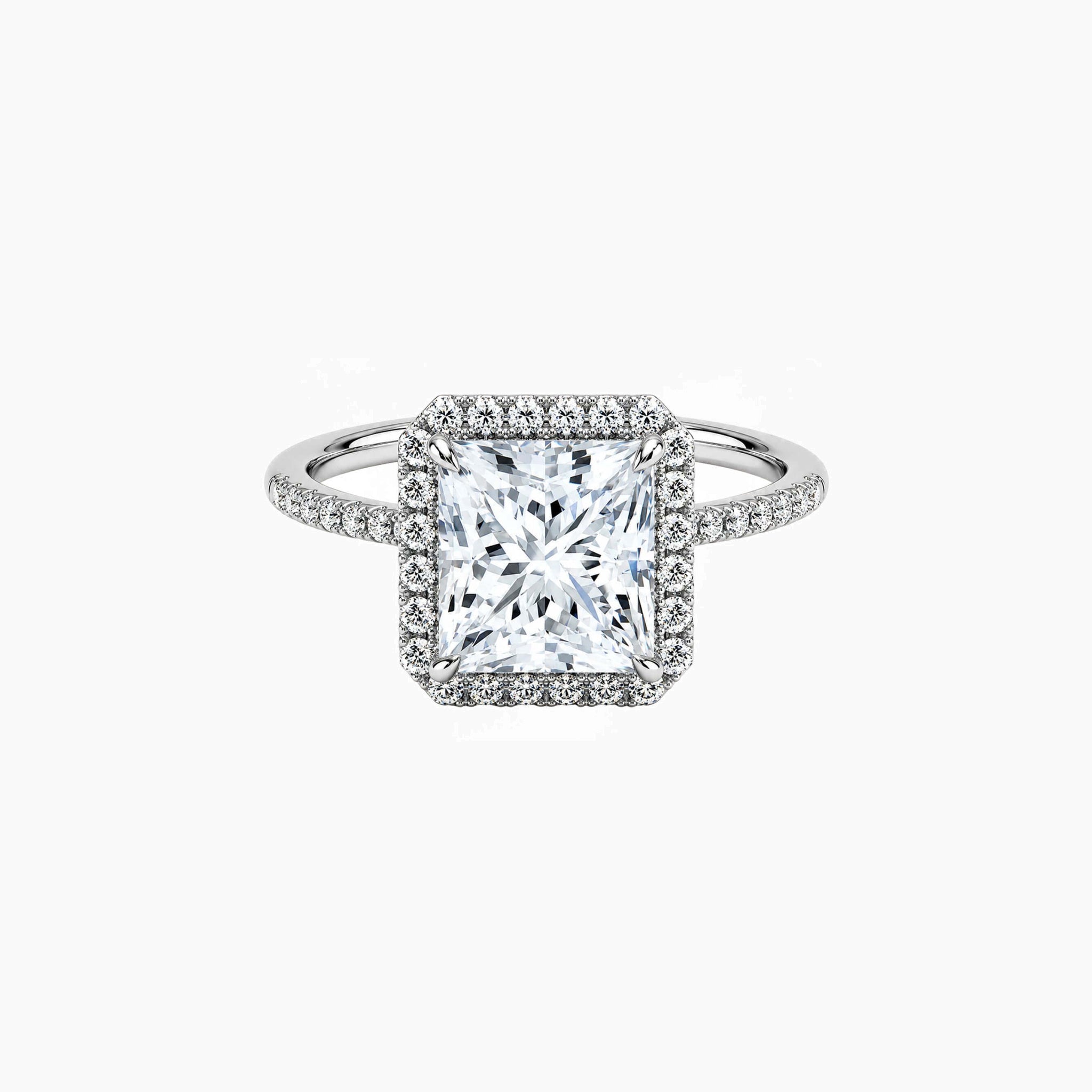 Princess-cut moissanite halo ring with pavé band in white gold vermeil, front view.