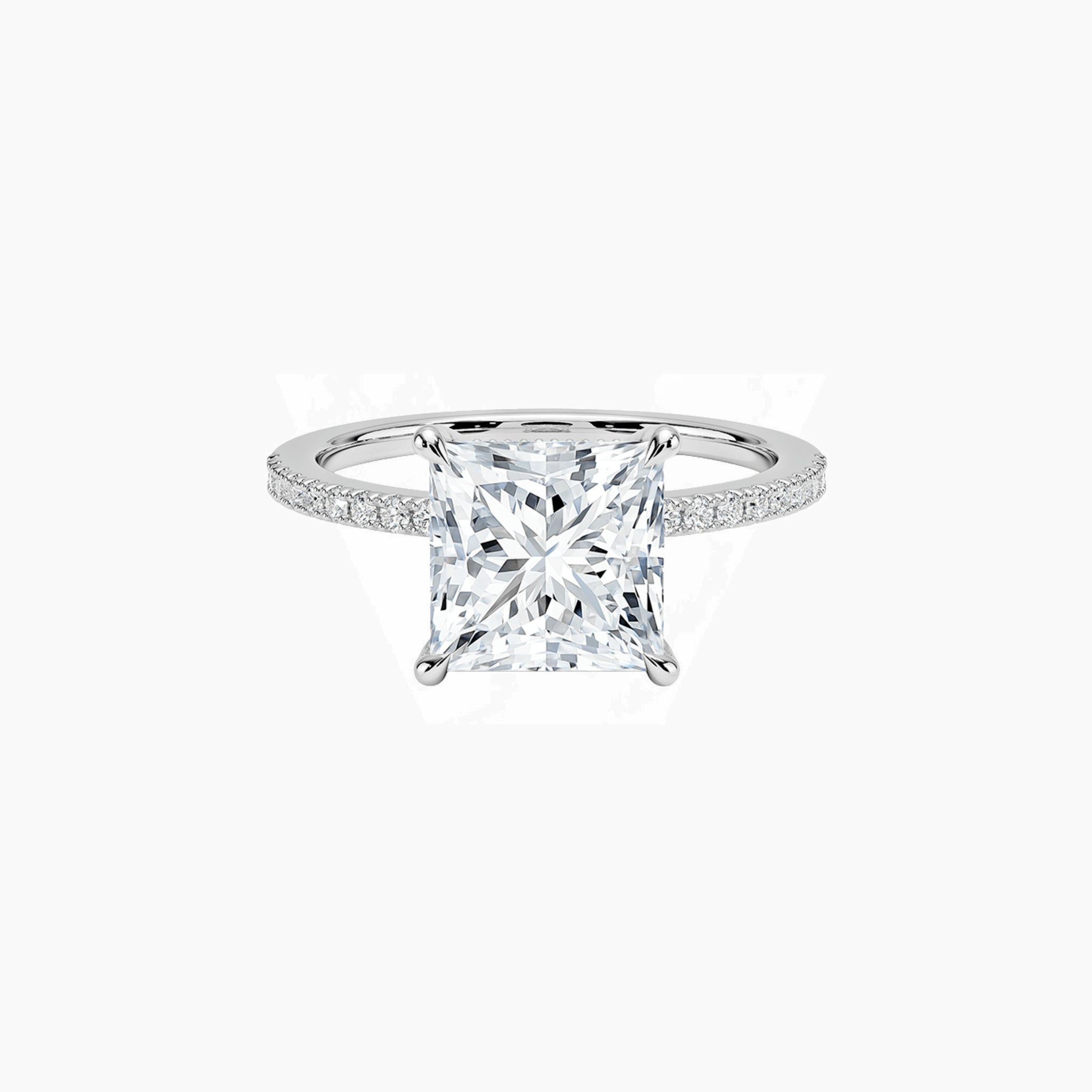 Princess-cut moissanite hidden halo ring with pavé band in white gold vermeil, front view.