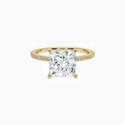 Princess-cut moissanite hidden halo ring with pavé band in yellow gold vermeil, front view.