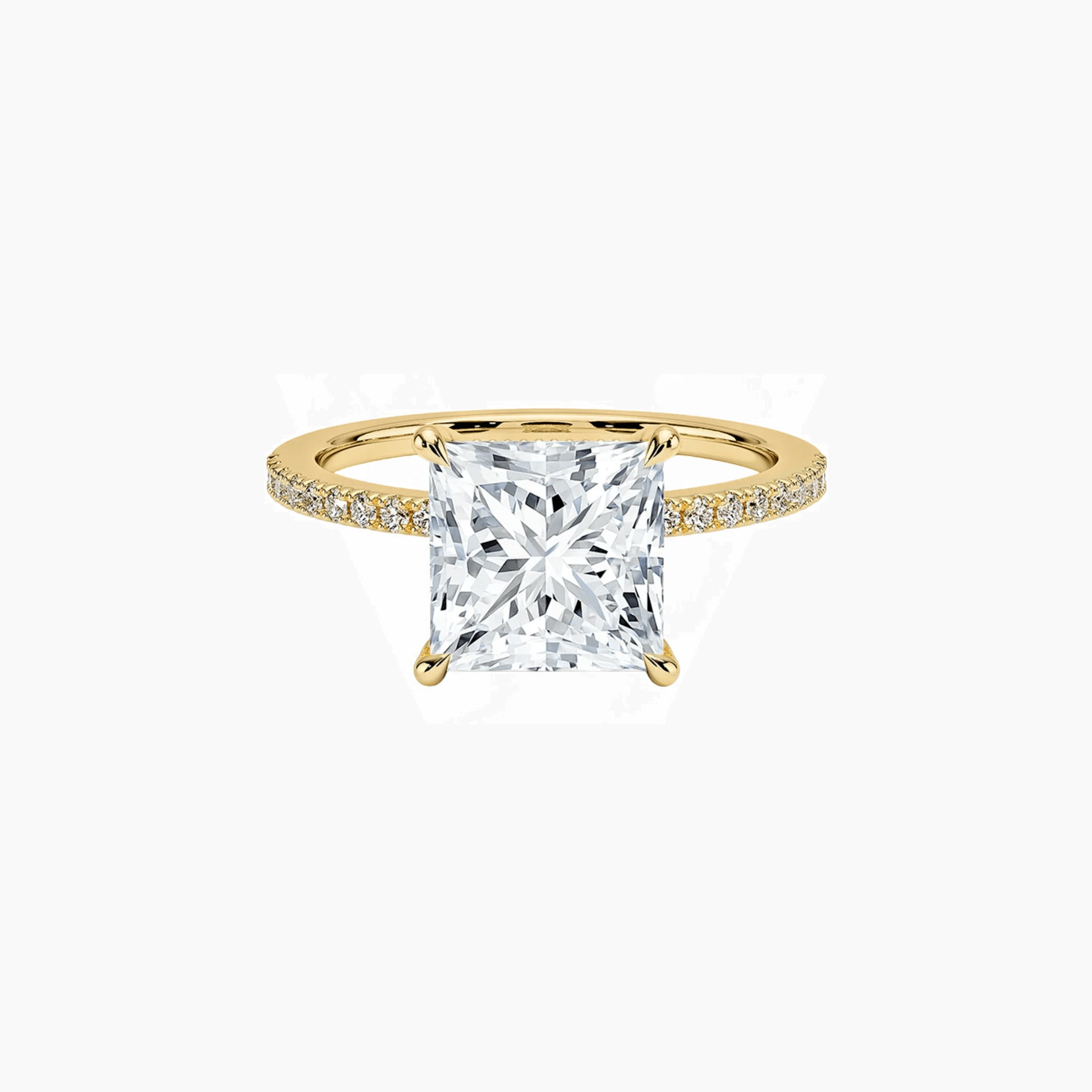 Princess-cut moissanite hidden halo ring with pavé band in yellow gold vermeil, front view.