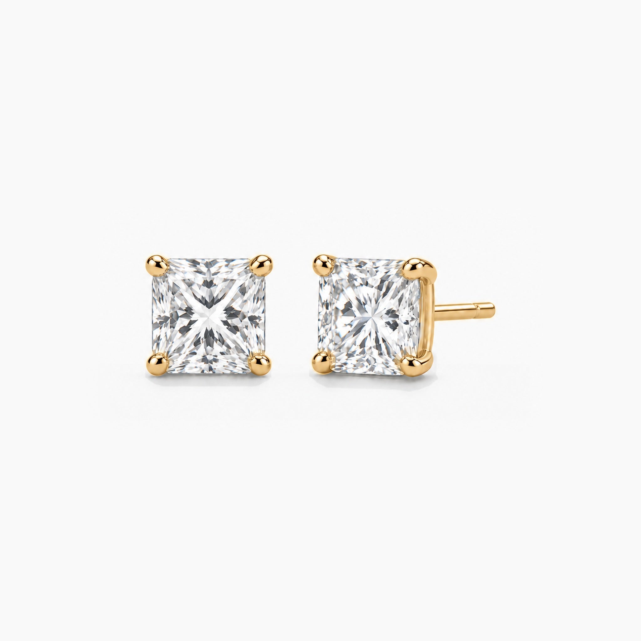 Princess-cut moissanite stud earrings in yellow gold vermeil, front and three-quarter views.