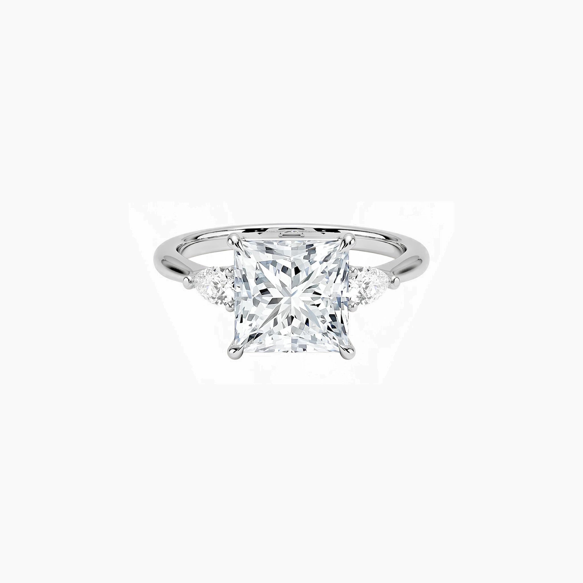 Princess-cut moissanite three-stone ring in white gold vermeil, front view.