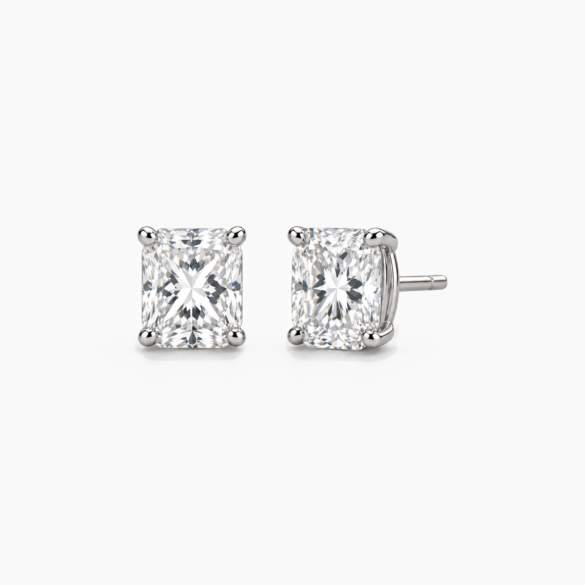 Radiant-cut lab-grown diamond stud earrings in 14k white gold, front and three-quarter views.