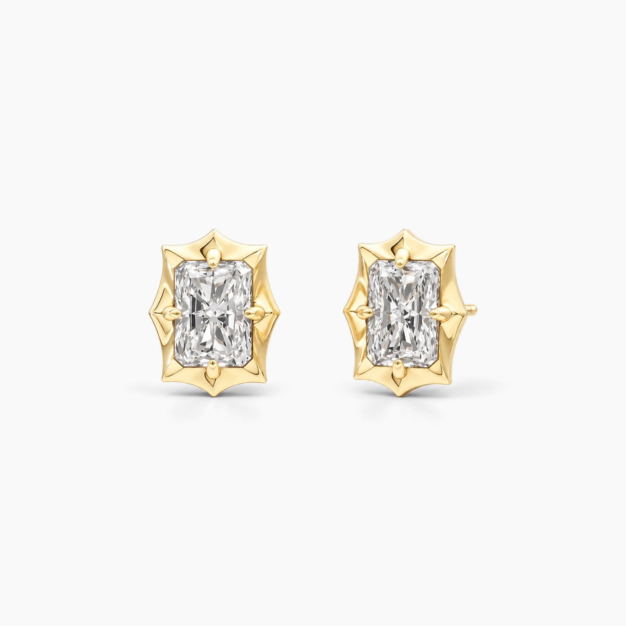 Radiant-cut moissanite bezel-prong stud earrings in 18k yellow gold vermeil, front and angled views.