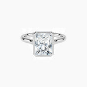 Radiant-cut moissanite bezel solitaire ring in white gold vermeil, front view.