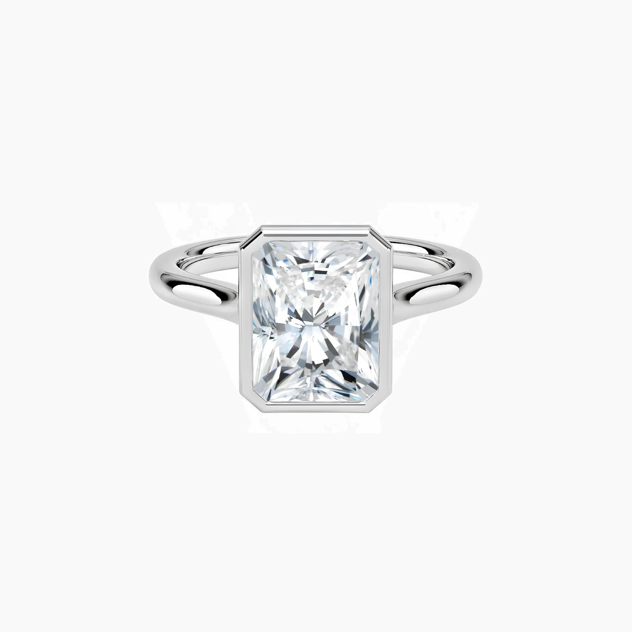 Radiant-cut moissanite bezel solitaire ring in white gold vermeil, front view.