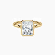 Radiant-cut moissanite bezel solitaire ring in yellow gold vermeil, front view.