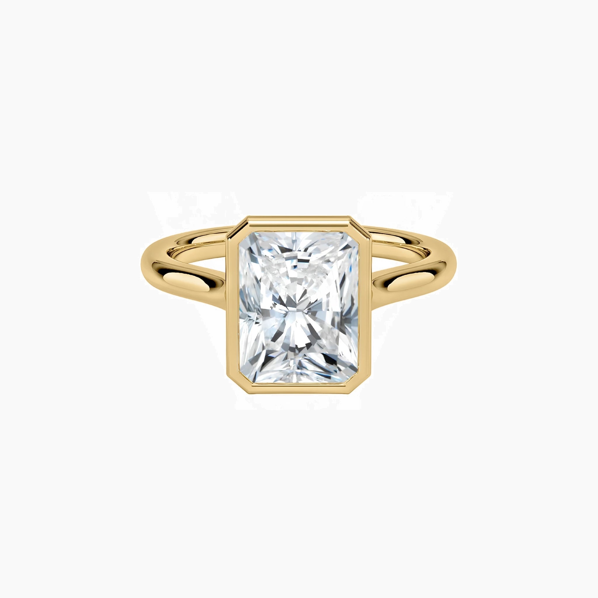 Radiant-cut moissanite bezel solitaire ring in yellow gold vermeil, front view.
