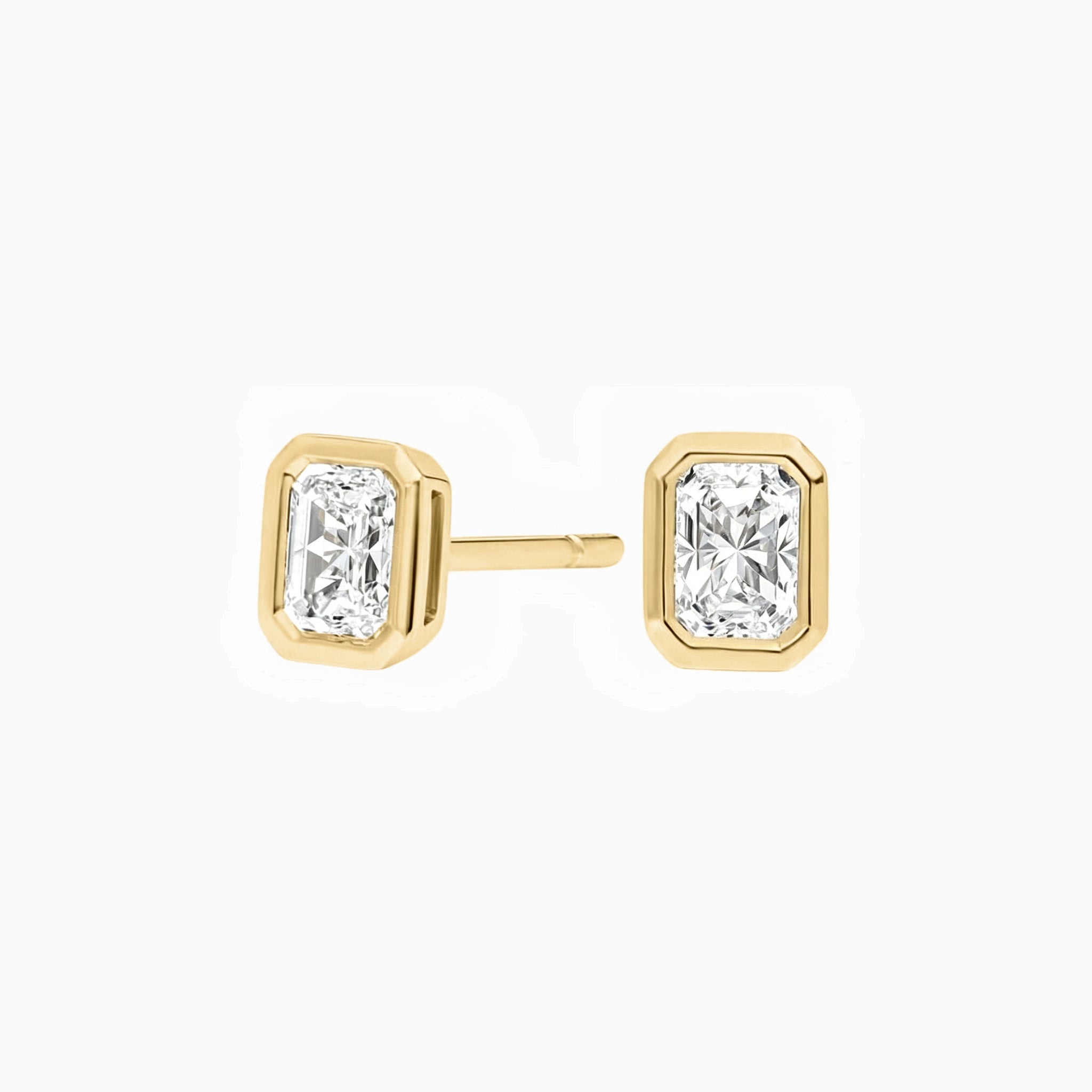 Radiant-cut moissanite bezel stud earrings in yellow gold vermeil, front and side views.