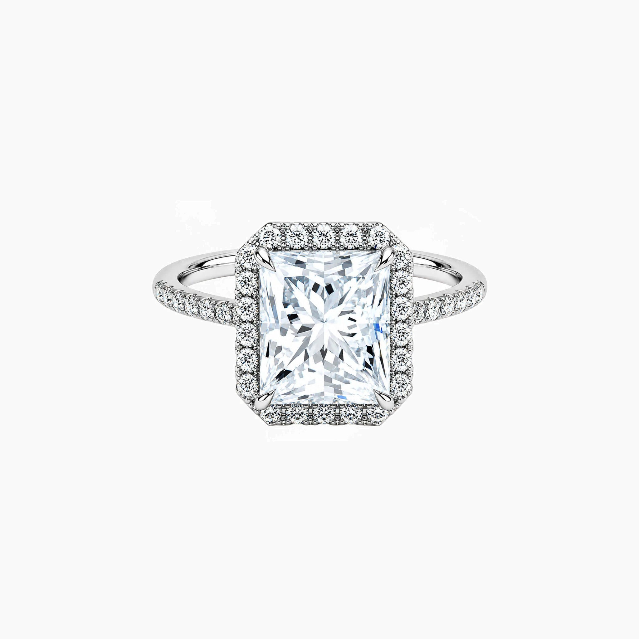 Radiant-cut moissanite halo ring with pavé band in white gold vermeil, front view.