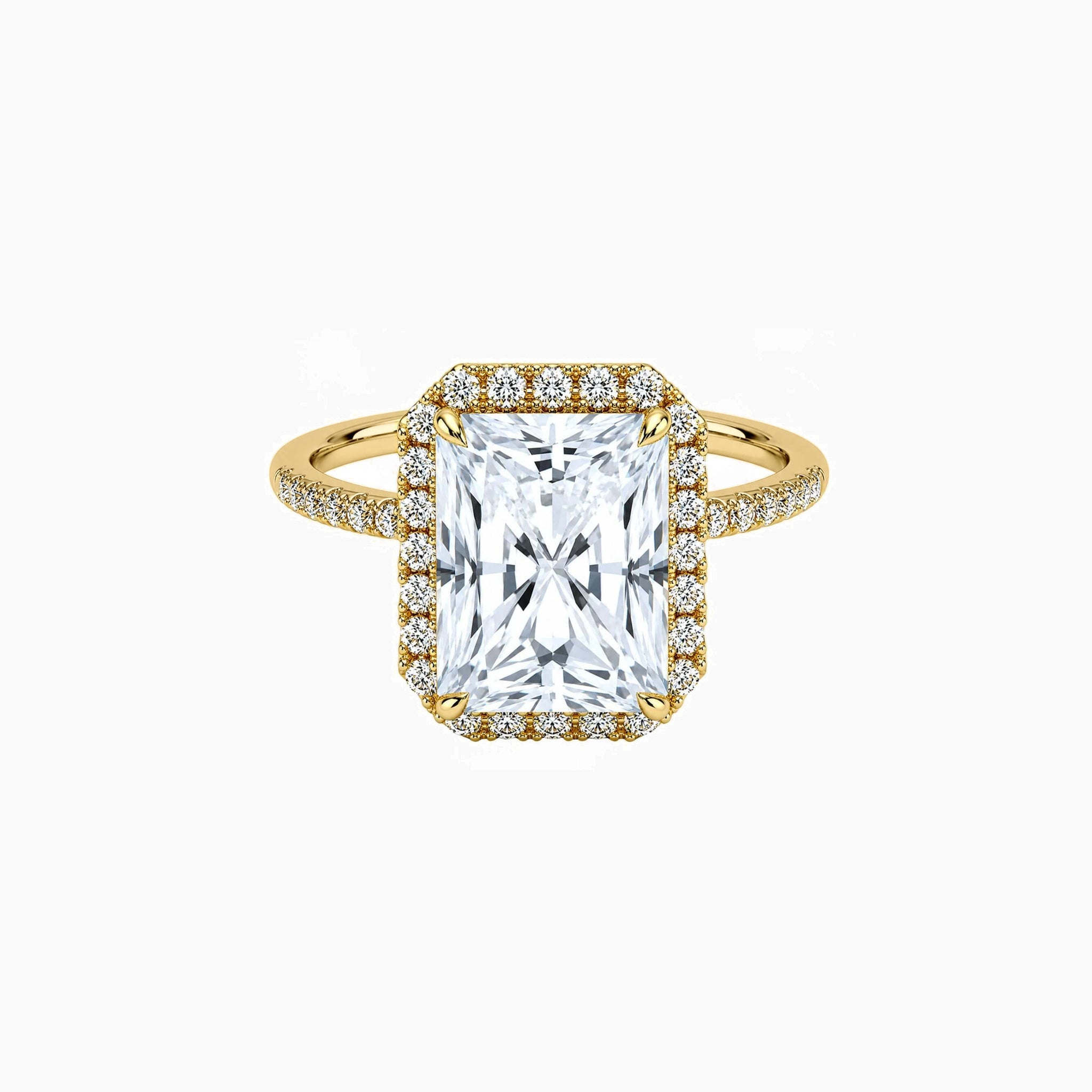 Radiant-cut moissanite halo ring with pavé band in yellow gold vermeil, front view.