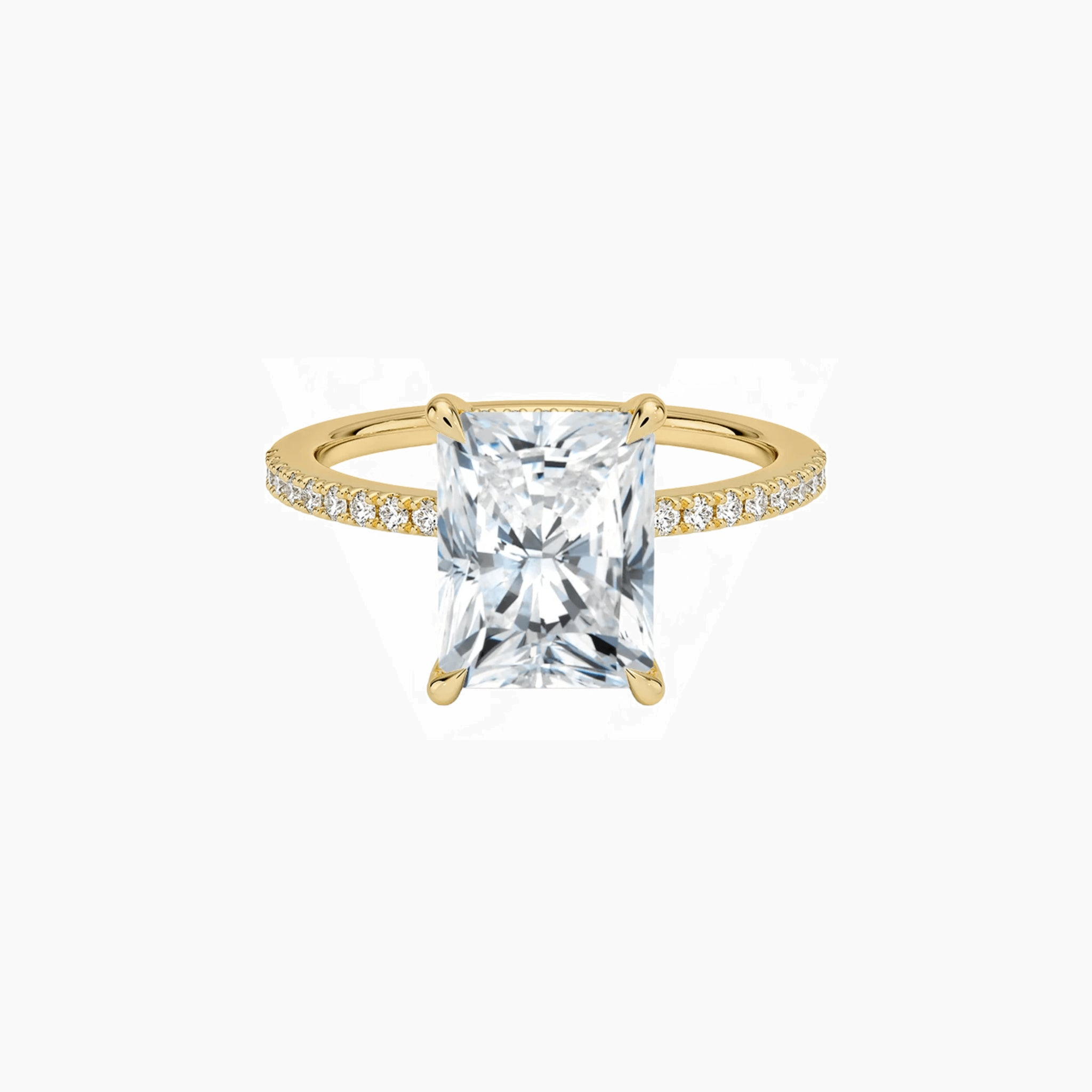 Radiant-cut moissanite hidden halo ring with pavé band in yellow gold vermeil, front view.
