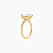 Radiant-cut moissanite hidden halo ring with pavé band in yellow gold vermeil, side view.