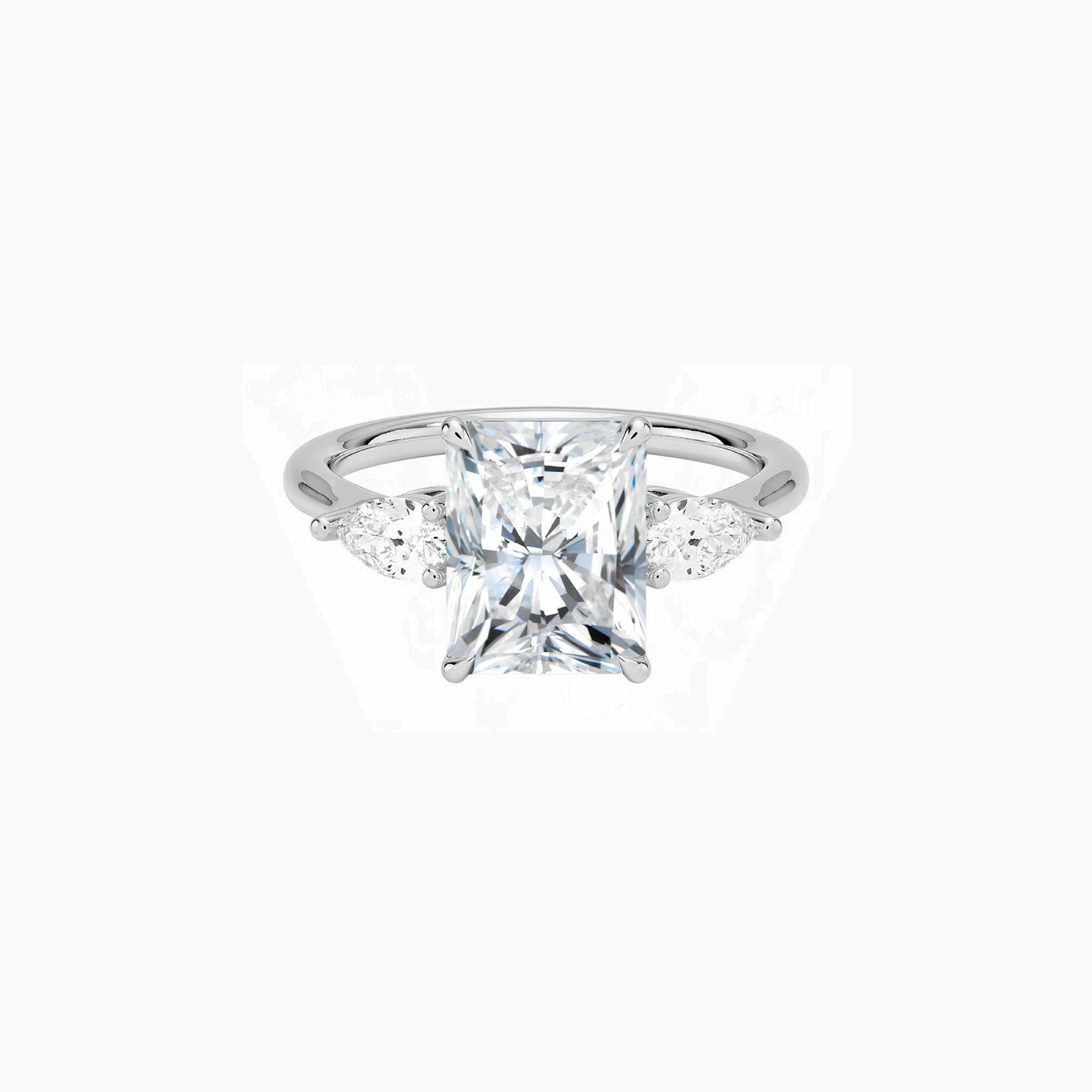 Radiant-cut moissanite three-stone ring in white gold vermeil, front view.