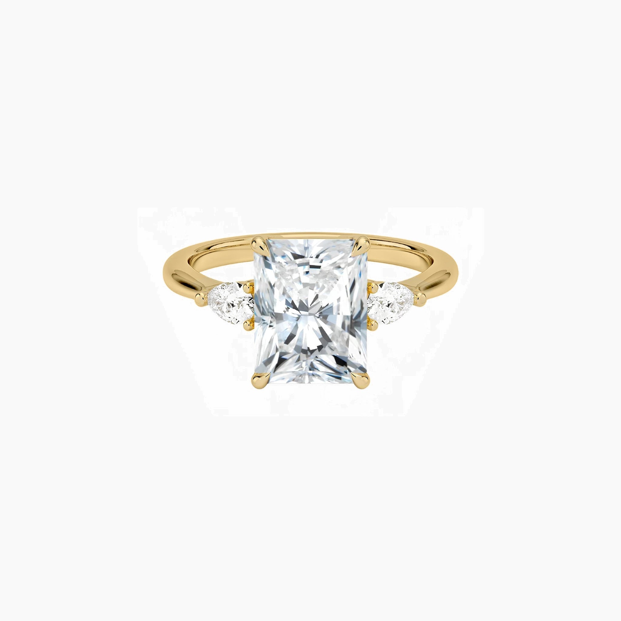 Radiant-cut moissanite three-stone ring in yellow gold vermeil, front view.