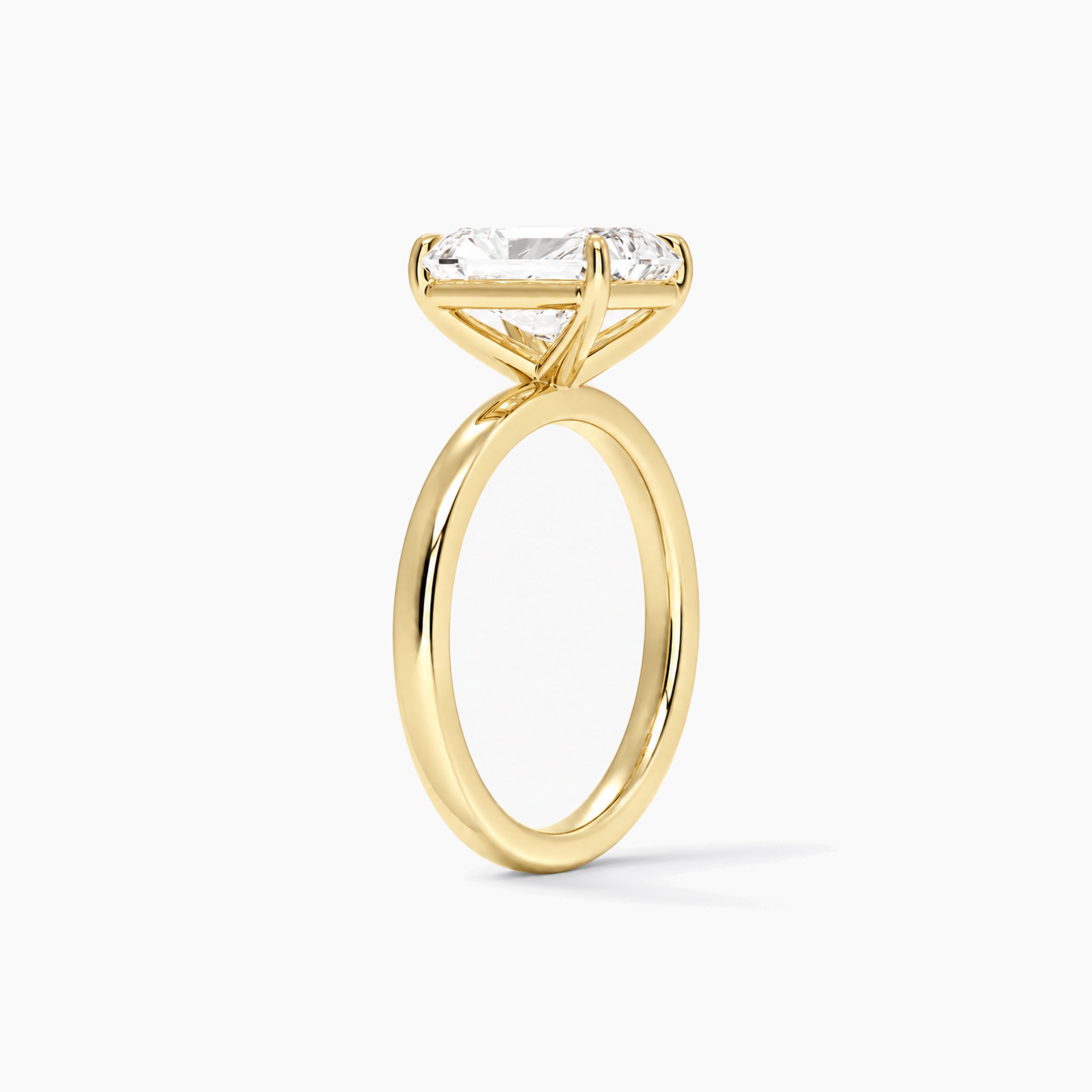 Radiant-cut moissanite solitaire ring in yellow gold, 2 carat side view
