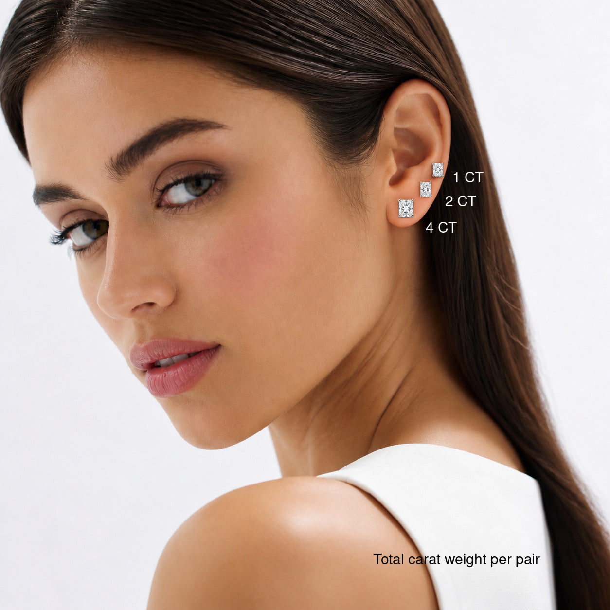 Radiant-cut lab-grown diamond stud earrings worn on a model, comparing 1, 2 and 4 ct total carat weight per pair.