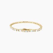 Round-cut and emerald-cut moissanite tennis bracelet in yellow gold vermeil, full product view.