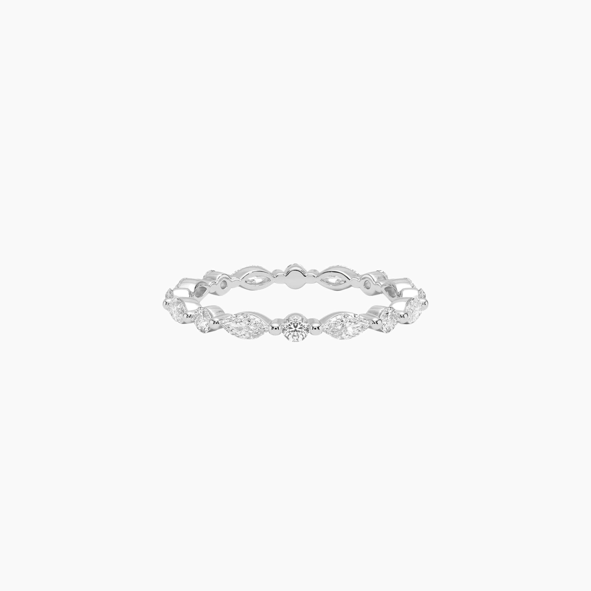 Round-cut and marquise-cut moissanite eternity ring in white gold vermeil, front view.