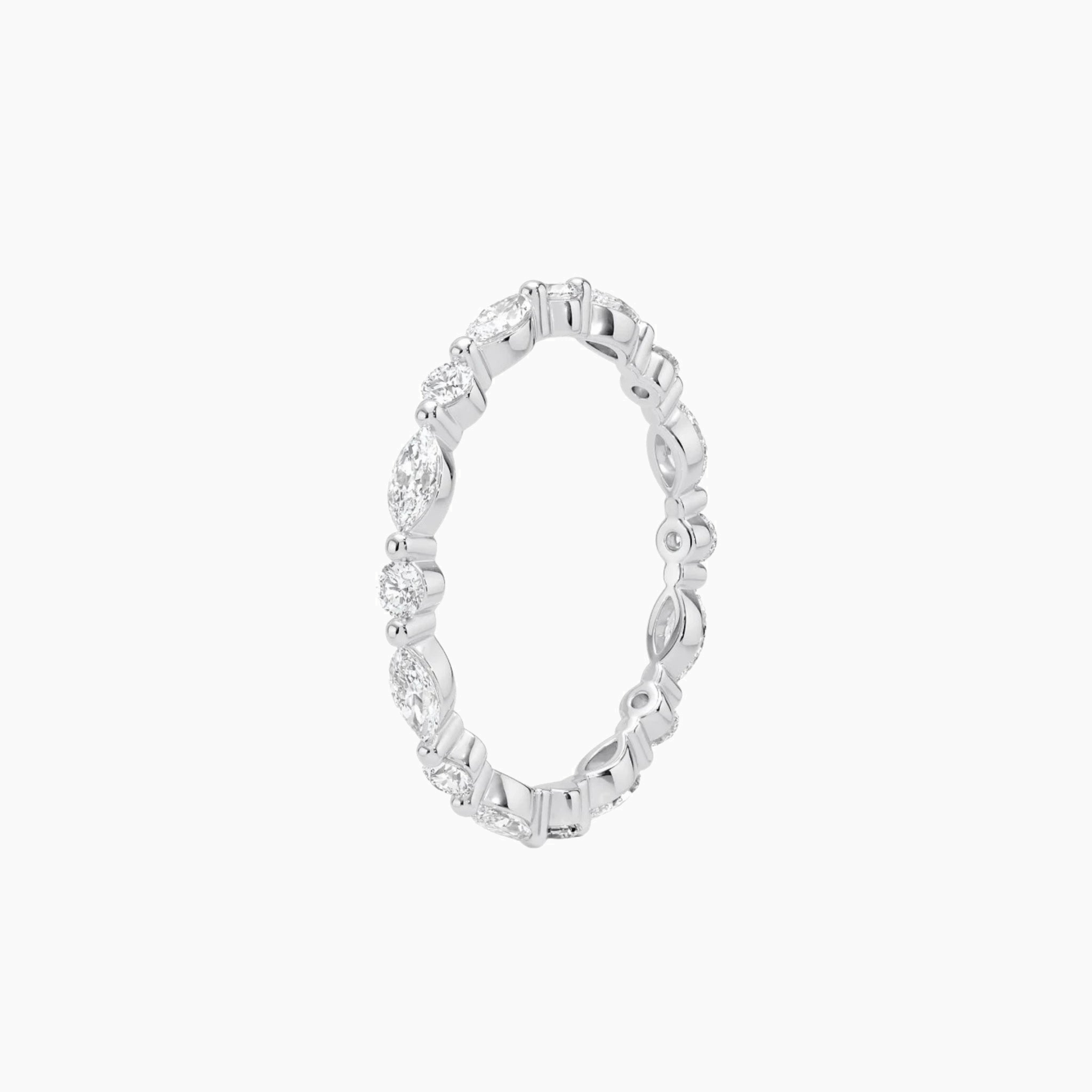 Round-cut and marquise-cut moissanite eternity ring in white gold vermeil, side view.
