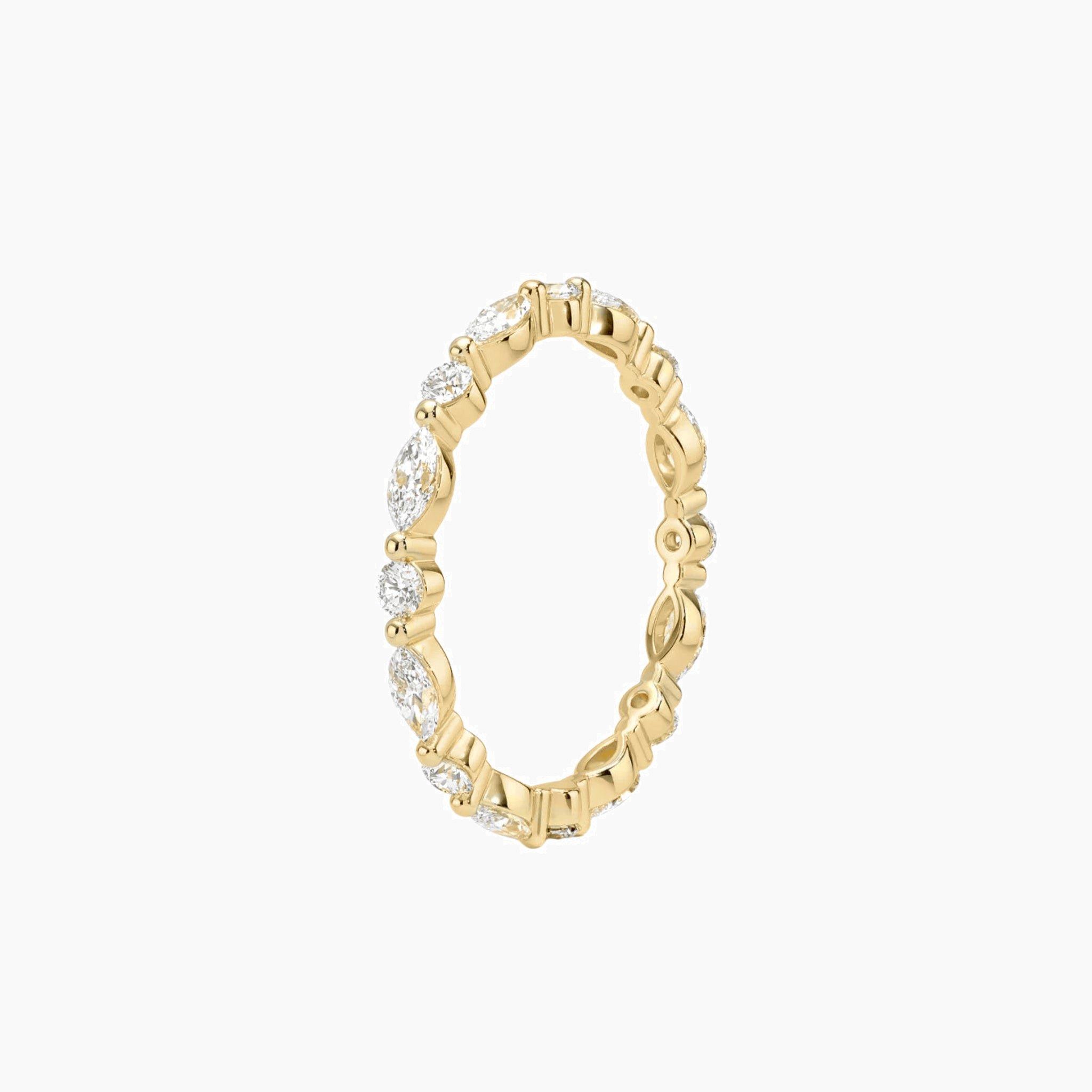 Round-cut and marquise-cut moissanite eternity ring in yellow gold vermeil, side view.