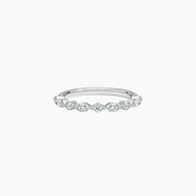 Round-cut and marquise-cut moissanite half eternity ring in white gold vermeil, front view.