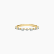 Round-cut and marquise-cut moissanite half eternity ring in yellow gold vermeil, front view.