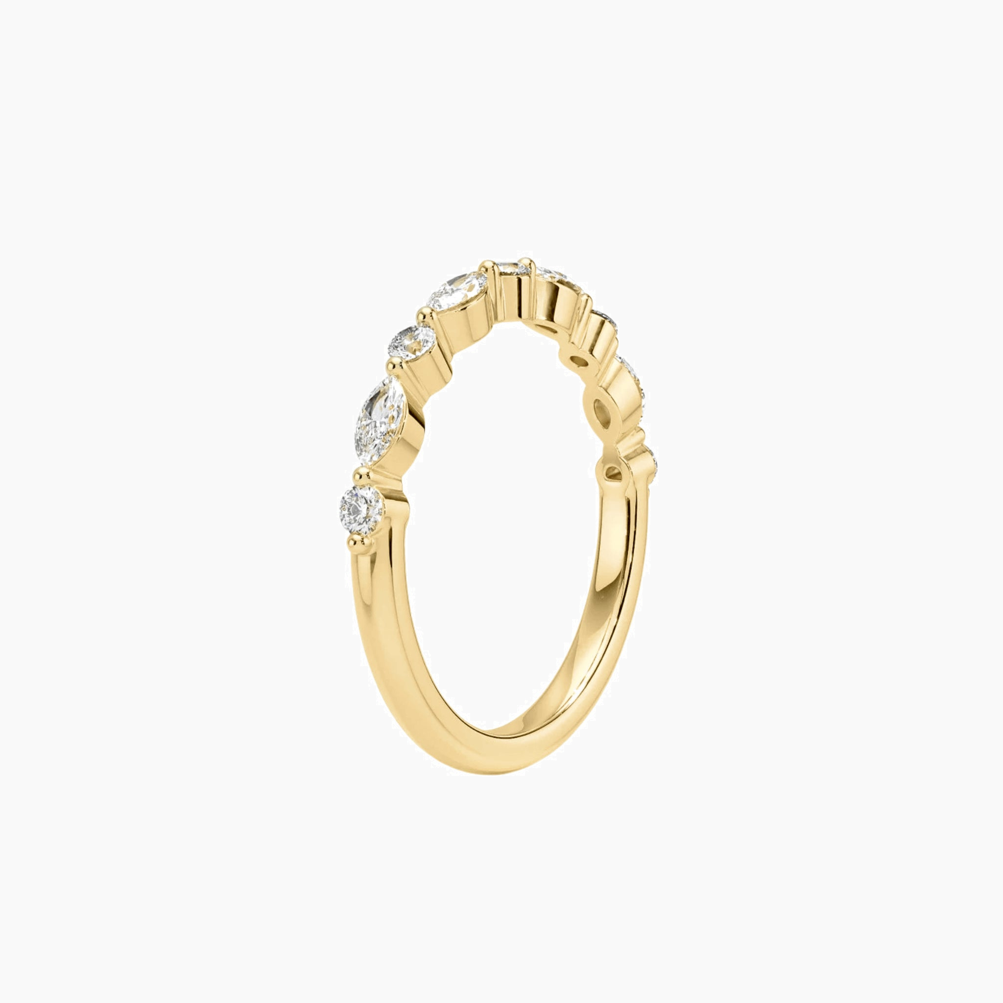 Round-cut and marquise-cut moissanite half eternity ring in yellow gold vermeil, side view.