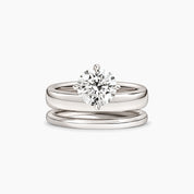 Round-cut moissanite double-band solitaire ring in white gold vermeil, front view.