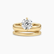 Round-cut moissanite double-band solitaire ring in yellow gold vermeil, front view.