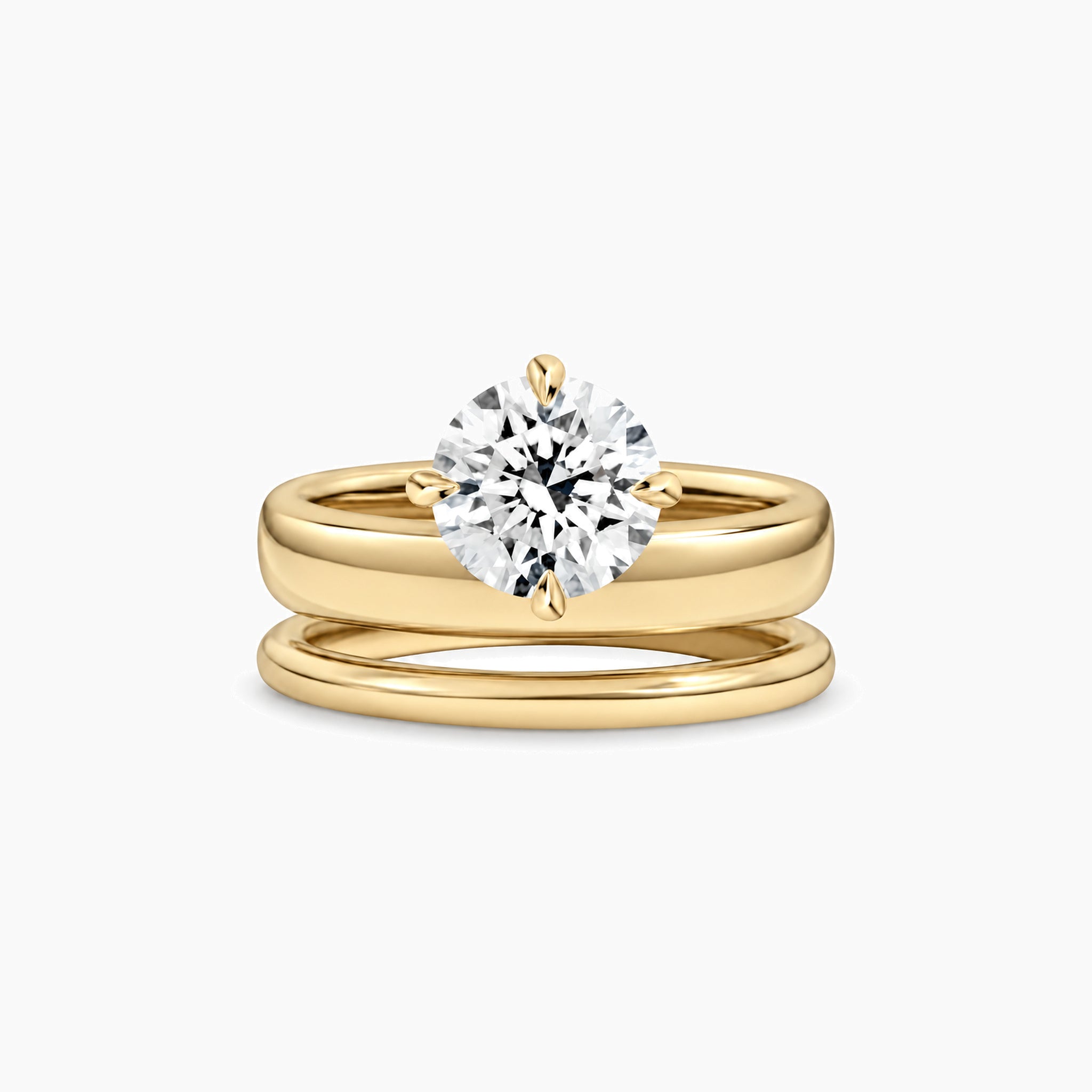 Round-cut moissanite double-band solitaire ring in yellow gold vermeil, front view.