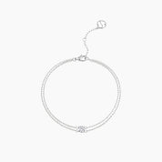 Round-cut moissanite double-chain bracelet in white gold vermeil, full product view.