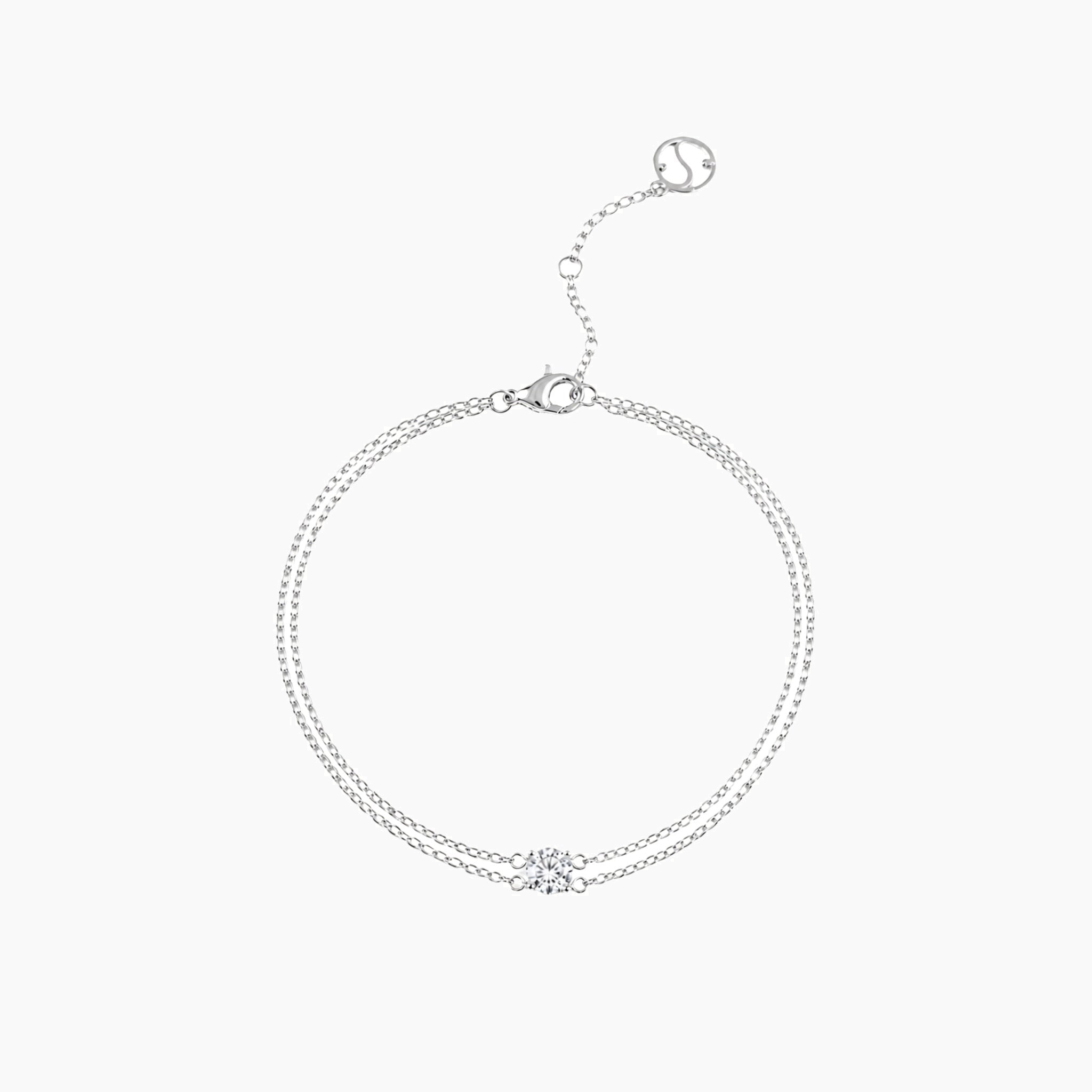 Round-cut moissanite double-chain bracelet in white gold vermeil, full product view.